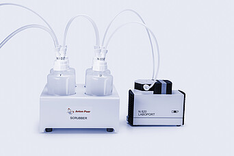 Anton Paar Scrubber system with dual gas diffusers connected to a KNF N 820 LABOPORT pump, showcasing corrosion-resistant components, transparent gas bottles, and tubing for safe evaporation processes. Designed for compatibility with Multiwave PRO and Multiwave 5000 microwave systems.