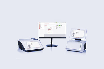 Cora 5001 Raman spectrometer and Lyza 7000 FTIR spectrometer connected to a central monitor displaying the Spectroscopy Suite spectral analysis software
